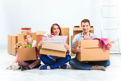 Man with van removal service helping a Ham customer move household items