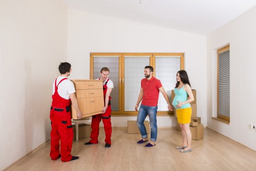 Local movers handling fragile items and furniture with care