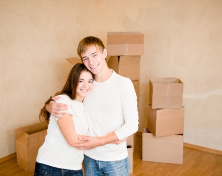 Moving boxes and furniture prepared for a local relocation