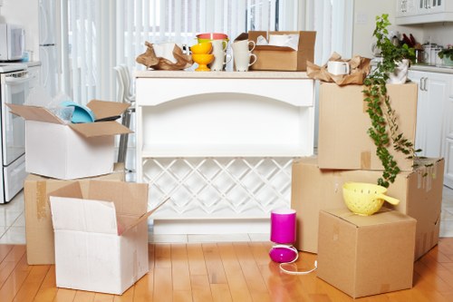Packed boxes and furniture ready for transport in Ham