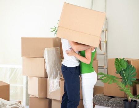Local moving team handling furniture loading in Ham