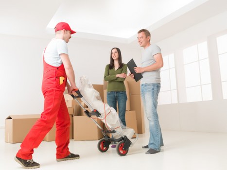 Packed boxes and furniture ready for house removal in Ham