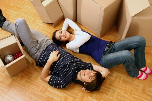 Moving team loading boxes and household items in Ham
